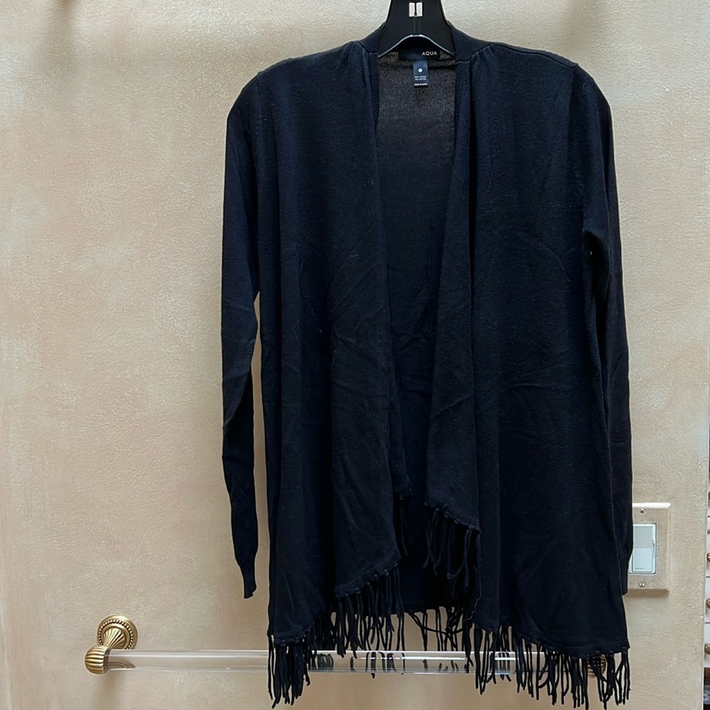 Fringed black cardigan.